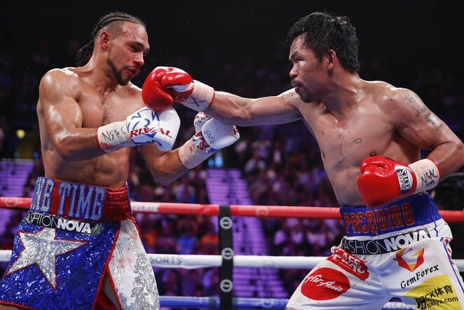 Manny Pacquiao ir Keitho Thurmano kovos akimirka | Scanpix nuotr.